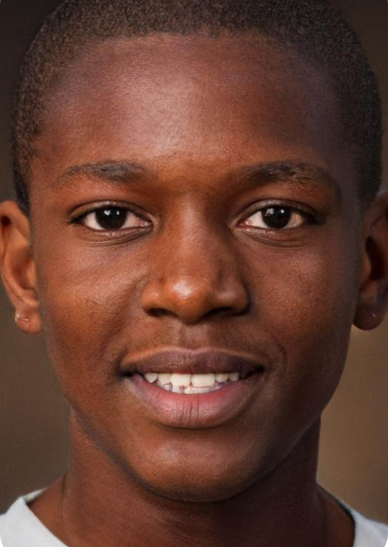 Portrait of a young Black male tutor aged 23, smiling, representing a satisfied customer